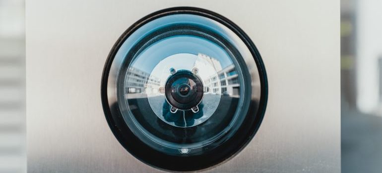 A modern front-door home security camera.